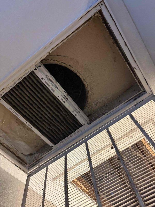 Responded to service call for zoned HVAC system with reversed damper operation on 5-ton unit. Inspected two-zone damper configuration and return air vents, documenting existing installation with poor accessibility and deteriorated ceiling conditions around vent openings. Customer reported issue present since home purchase three years ago with four previous companies unable to resolve damper reversal problem without recommending full system replacement. Assessed damper wiring and zone control board connections to determine if simple rewiring could correct reversed operation versus requiring damper replacement or system modification.