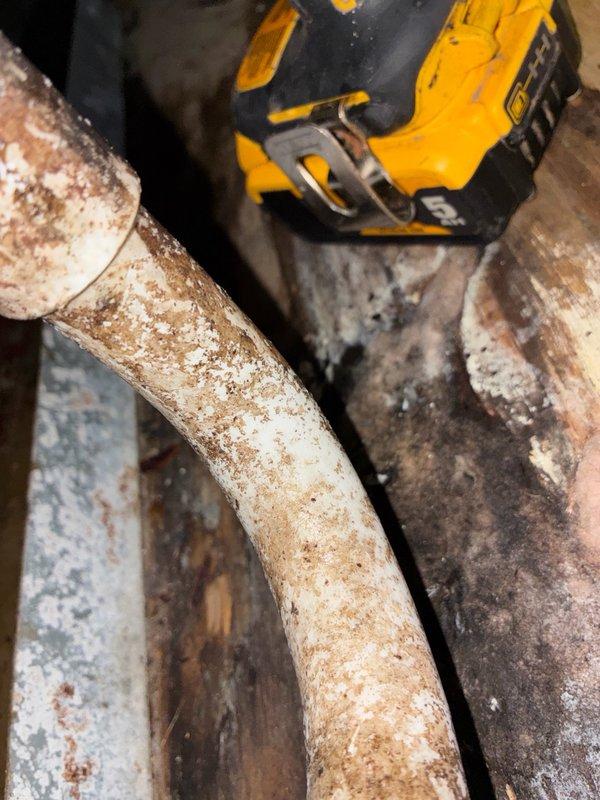 Responded to no cooling call with outdoor unit not operating. Upon arrival, found system with no refrigerant charge. Inspection revealed severely corroded refrigerant lines in attic space showing extensive rust and deterioration from moisture exposure. Lines exhibited significant oxidation and compromised integrity, indicating long-term leak condition resulting in complete refrigerant loss. Documented existing conditions with photos showing deteriorated piping and surrounding HVAC infrastructure. System requires refrigerant line replacement before charging and restoring operation.