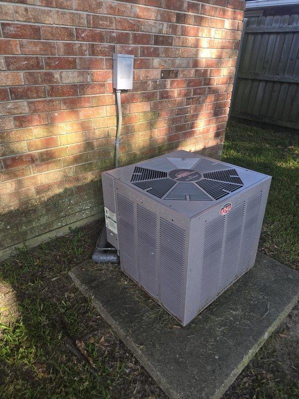 Completed installation of 3-ton electric economy air conditioning system at residential property. Installed outdoor condensing unit on existing concrete pad against brick exterior wall, positioned near PVC condensate drain line and wooden privacy fence. System specifications included air handler measuring 21x20x45 inches with 20x30 return and supply plenum dimensions of 15x19.5x76 inches. Configured ductwork with 4x10 transitions and installed 24x24 return grille in addition to bedroom supply register measuring 16 square feet. Built custom transition components to integrate new equipment with existing duct system. Total of 6 supply vents incorporated into final configuration. System tested and operational upon completion.