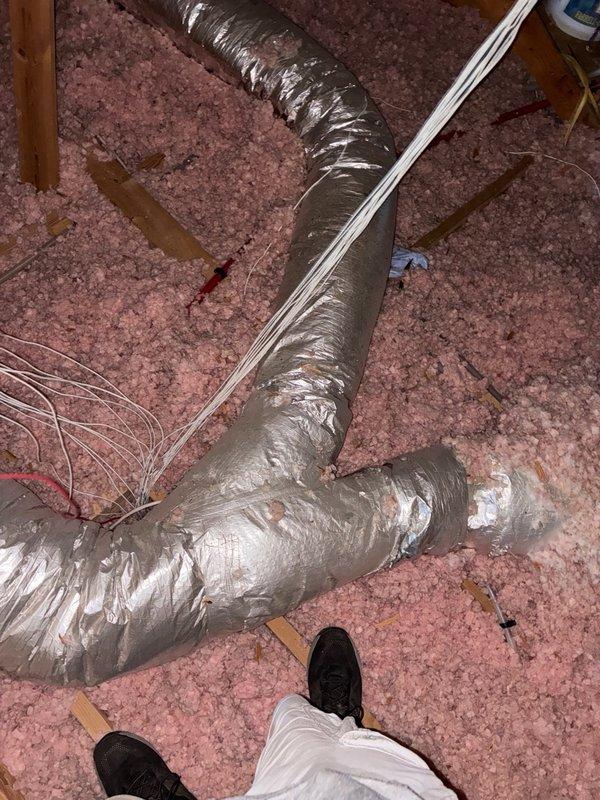 Responded to complaint of inadequate airflow to one side of residence. Performed visual inspection of HVAC ductwork system in attic space. Examined flexible duct runs, insulation integrity, and distribution system serving affected areas. Documented conditions of metallic flex duct, attic insulation, and overall system configuration with photos for member records.