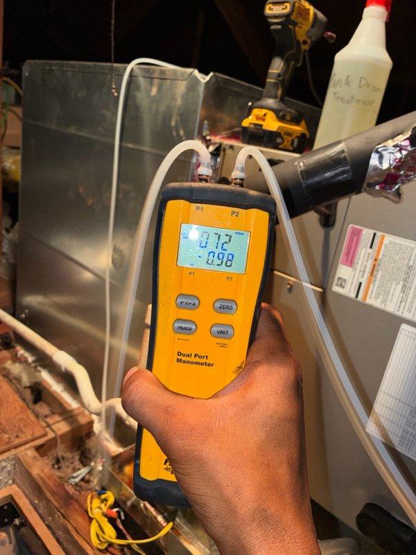 Responded to no cooling call with thermostat reading 82 degrees. Upon arrival, performed system diagnostics using digital manometer to measure static pressures and airflow characteristics. Inspected HVAC equipment and associated ductwork in mechanical space, documenting existing conditions including refrigerant lines, drainage components, and system valves. Customer unable to access attic area to verify drain pan status at time of service. Equipment showed signs of age with visible dust accumulation and wear on components.