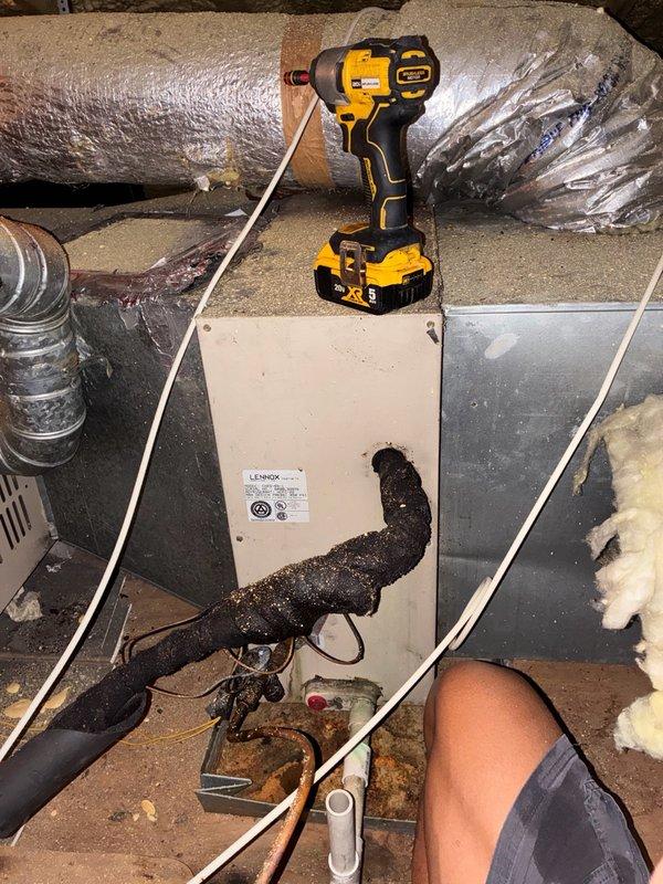 Responded to after-hours service call for HVAC system experiencing intermittent freezing and cycling issues. Upon arrival, accessed attic space and inspected Lennox system components including air handler, ductwork, and refrigerant lines. Observed corroded copper refrigerant line connections showing significant oxidation and deterioration at connection points. Evaluated flexible ductwork routing and condition throughout crawl space, noting dust accumulation and general wear. Assessed electrical connections and control box operation. Documented equipment condition and system configuration with photographs for service records. System evaluated for potential refrigerant leak at corroded pipe connections and cycling control issues requiring further diagnosis or follow-up service.