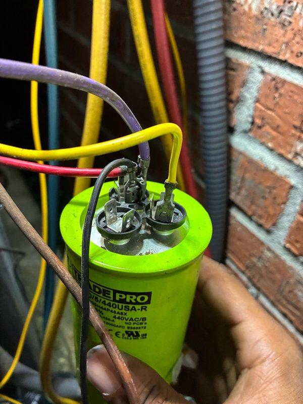 Responded to cooling complaint on dual-system property where units were not reaching setpoint of 70°F and only cooling to 72°F. Diagnosed failed capacitor on affected system using Fieldpiece SC260 clamp meter to verify electrical readings. Replaced defective capacitor with new TRADE PRO unit, reconnected all electrical terminals, and verified proper amperage draw of 123 amps. System tested and confirmed operational with proper cooling cycle restored.