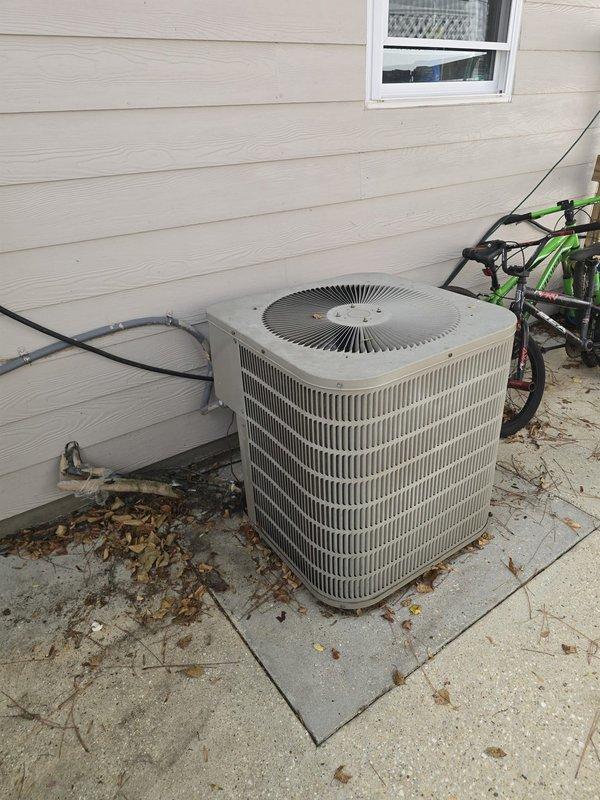 Completed comprehensive estimate for full HVAC system replacement of existing R22 unit. Assessed current outdoor condensing unit mounted on concrete pad with electrical disconnect and refrigerant line routing along exterior wall. Documented existing system configuration including conduit placement, utility connections, and equipment positioning for replacement specifications.
