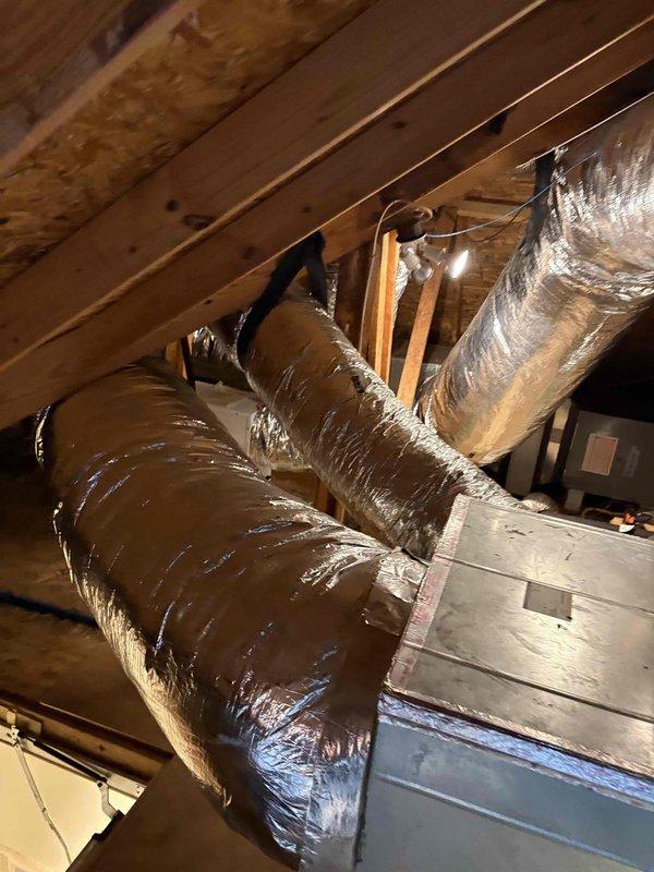 Completed comprehensive AC cleaning and inspection on a 3-year-old Daikin system located in attic installation. Performed thorough maintenance of air handler unit, inspected flexible ductwork routing and connections, verified proper system operation, and documented equipment condition with photographs for service records.