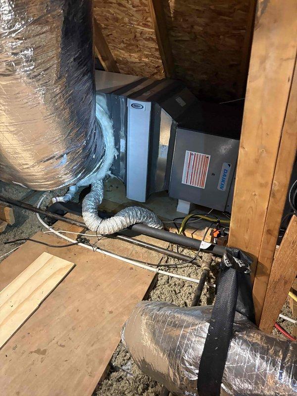 Completed comprehensive AC cleaning and inspection on a 3-year-old Daikin system located in attic installation. Performed thorough maintenance of air handler unit, inspected flexible ductwork routing and connections, verified proper system operation, and documented equipment condition with photographs for service records.