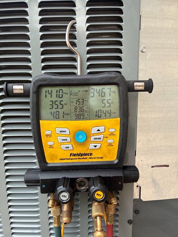 Responded to callback for non-operational 4-ton condenser unit that was recently installed. Upon arrival, performed comprehensive diagnostic testing using refrigerant manifold and micron gauge to verify system pressures and temperatures across multiple test points. Measured electrical current draw at 11.39 amps using clamp meter at the electrical panel to assess compressor and fan motor operation. Inspected all electrical connections, circuit breakers, and wiring at the disconnect panel. Evaluated refrigerant line connections and brass fittings for proper installation and potential leaks. Documented system readings and equipment condition with photos for service records. System restored to proper operation and verified all parameters within manufacturer specifications before departure.