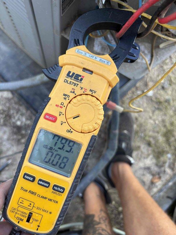 Responded to customer complaint of loud buzzing noise from outdoor condensing unit on downstairs system. Upon arrival, performed diagnostic testing on affected unit using clamp meter and insulation resistance testing equipment. Measured electrical parameters including voltage (1008V reading) and current draw (149.2A reading) to identify source of abnormal noise. Conducted insulation resistance test using Supco megohmmeter to evaluate compressor winding integrity and electrical components. Test results indicated readings within acceptable range on insulation test. Both HVAC systems confirmed operational and providing adequate cooling at time of inspection. Documented findings with diagnostic equipment readings for service records.