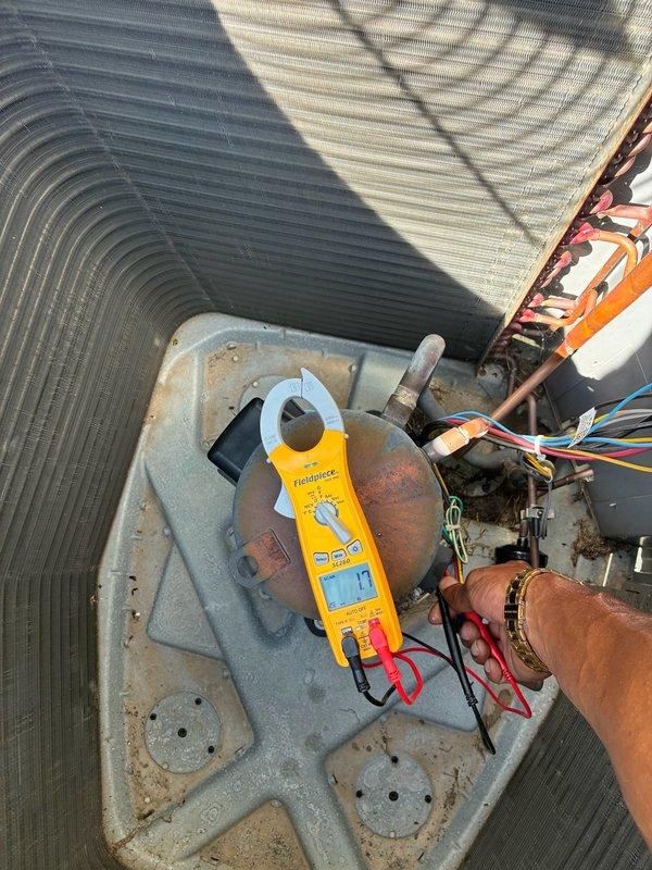 Performed second opinion evaluation on Lennox two-stage cooling system after conflicting diagnoses from two previous contractors regarding capacitor replacement versus indoor coil leak requiring full indoor unit replacement. Conducted thorough system inspection and diagnostic testing of outdoor condensing unit, including electrical measurements with clamp meter and visual inspection of electrical components, contactors, and wiring connections. Verified system operational status and examined refrigerant lines for signs of corrosion or leakage. Documented findings with photographic evidence of electrical panel interior and outdoor unit components to provide accurate assessment and present alternative repair options beyond those previously offered.