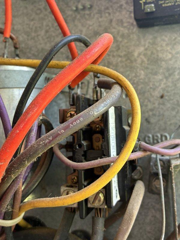 # VIJ - Dispatch Completed

Responded to customer concern regarding loud humming noise from outdoor condenser unit. Upon arrival, performed comprehensive inspection of air conditioning system and electrical components. Unit was operational at time of inspection with no abnormal sounds present. Conducted thorough examination of contactor, capacitor, and all electrical connections within junction box. Documented heavy dust and debris accumulation on internal wiring and components. Inspected compressor operation, fan motor function, and verified proper electrical connections at all terminals. Unit operating within normal parameters during diagnostic testing. Photographed outdoor condenser unit placement and internal electrical components for service records. Advised customer that system is functioning properly with no immediate concerns identified, though noted age-related wear and contamination present in electrical compartment.