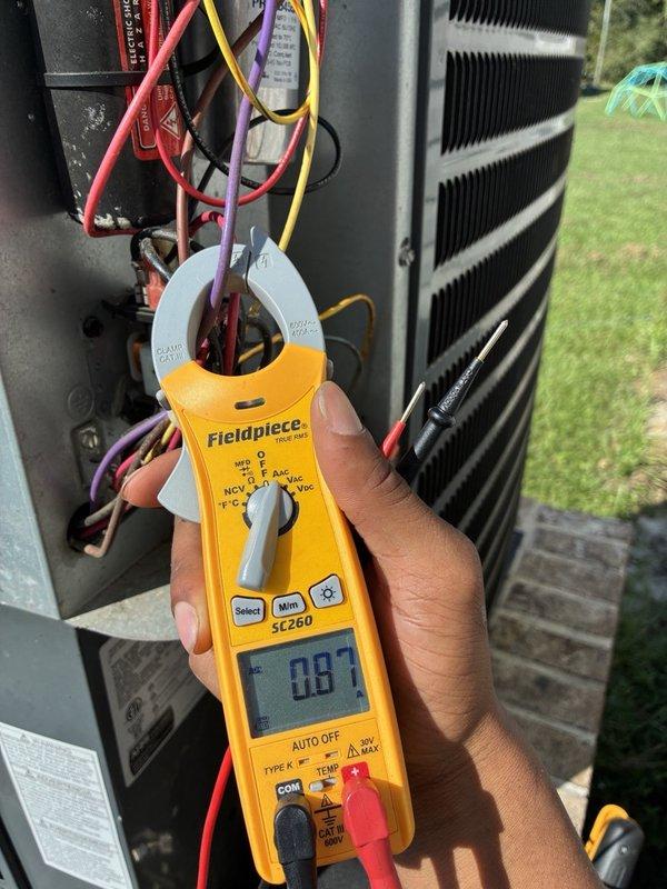 Completed comprehensive blower and evaporator coil maintenance on residential HVAC system. Performed full blower assembly removal, thorough cleaning of blower wheel and housing to remove accumulated dirt and debris. Executed evaporator coil pull and deep cleaning to restore optimal heat transfer efficiency and airflow. Conducted electrical diagnostics using clamp meter to verify proper amperage draw and system performance. Measured operating temperature at 20.0°F, confirming adequate refrigerant charge and system functionality. Reassembled all components, secured electrical connections, and verified unit operates within manufacturer specifications. System returned to normal operation with improved airflow and efficiency.