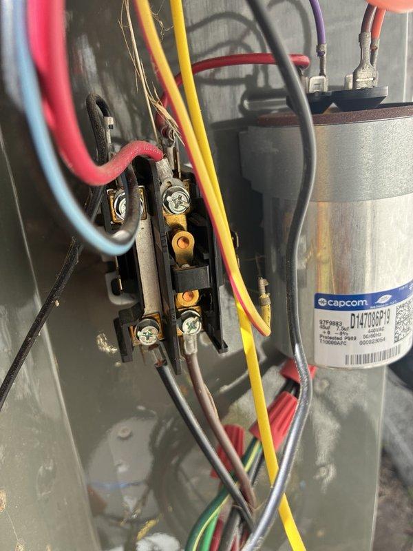 Completed comprehensive AC tune-up service on single-system residential unit for maintenance member. Performed thorough inspection of outdoor condenser unit, which exhibited heavy accumulation of dirt, debris, and organic matter throughout interior components and on condenser coils. Verified electrical connections at contactor and capacitor, noting Capcom capacitor showing surface oxidation but functioning within normal parameters. Recorded amp draw reading of 18 amps using clamp meter during operational testing. All electrical components, wiring terminals, and connections inspected and confirmed secure with no immediate concerns noted.