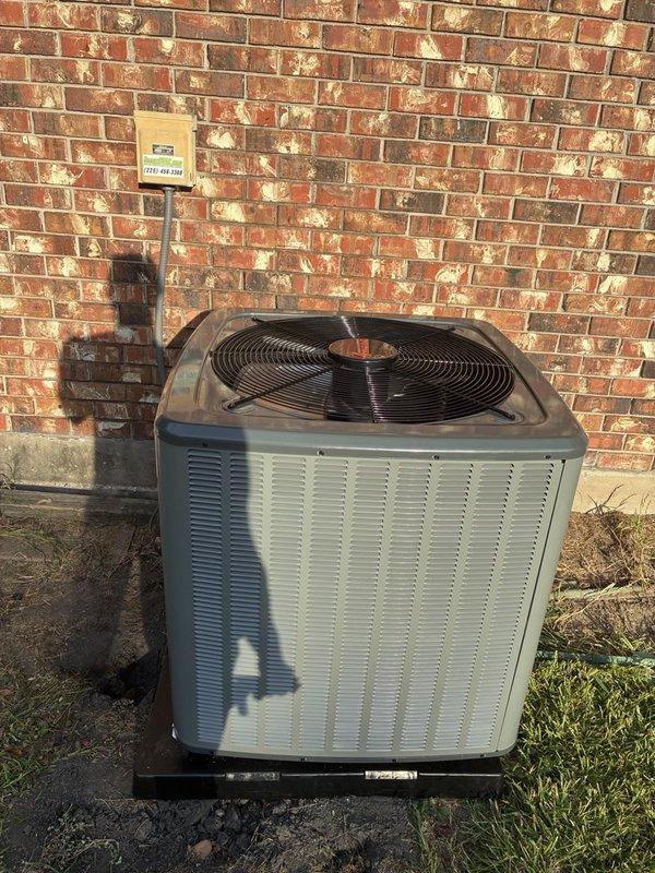 # Install Completed

Successfully installed a 4-ton outdoor condensing unit on a concrete pad against the exterior brick wall. The new unit features proper ventilation louvers and fan assembly, positioned to ensure optimal airflow and accessibility for future maintenance. Refrigerant lines and electrical connections were properly routed and secured along the building structure.

# Follow-Up Required

During post-installation inspection, discovered significant frost accumulation on the evaporator coil and associated ductwork components in the indoor air handler location. The heavy ice buildup on metal surfaces with crystalline formation indicates a potential refrigerant charge issue, airflow restriction, or system imbalance that requires immediate attention. This condition was documented with photographic evidence showing the extent of frost coverage on the coil assembly and mounting hardware. System will need to be evaluated for proper refrigerant levels, airflow measurements, and mete