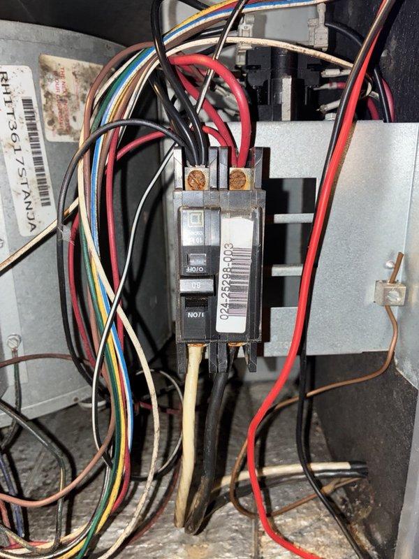 Responded to no-power call with blank thermostat. Upon arrival, found system completely inoperative with no display at thermostat. Inspected electrical panel and outdoor unit disconnect, verifying circuit breaker positions and wire connections at breaker assembly. Performed electrical diagnostics at outdoor unit, utilizing clamp meter to measure amperage draw on system components. Measured 0.38 amps during testing, indicating minimal current flow. Inspected capacitor connections and control wiring within outdoor unit electrical compartment. Identified power supply issue preventing system operation. Verified proper wire terminations at all connection points and checked for loose or damaged conductors throughout electrical pathway from breaker panel to outdoor equipment.