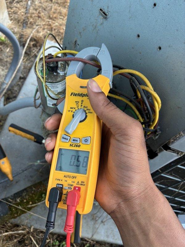 Responded to no-power call with blank thermostat. Upon arrival, found system completely inoperative with no display at thermostat. Inspected electrical panel and outdoor unit disconnect, verifying circuit breaker positions and wire connections at breaker assembly. Performed electrical diagnostics at outdoor unit, utilizing clamp meter to measure amperage draw on system components. Measured 0.38 amps during testing, indicating minimal current flow. Inspected capacitor connections and control wiring within outdoor unit electrical compartment. Identified power supply issue preventing system operation. Verified proper wire terminations at all connection points and checked for loose or damaged conductors throughout electrical pathway from breaker panel to outdoor equipment.