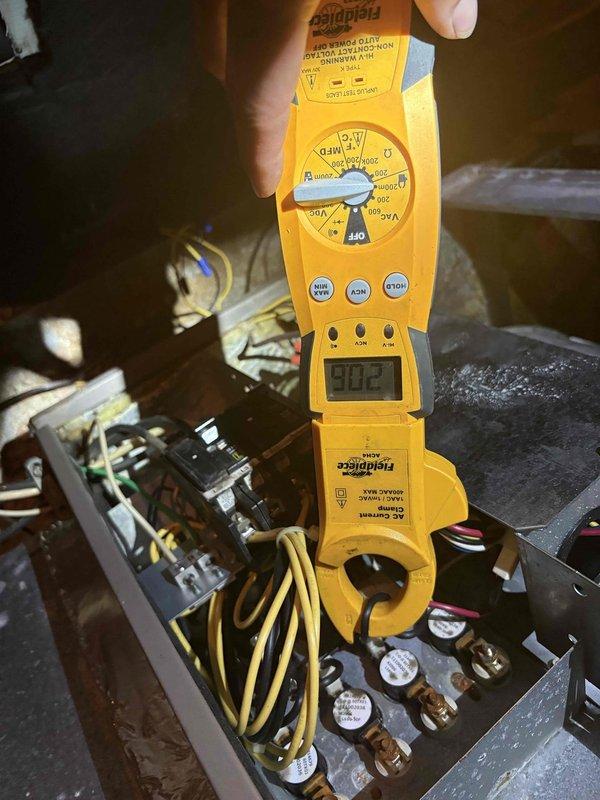 Completed comprehensive heater tune-up including thorough cleaning and inspection of HVAC system components. Performed electrical diagnostics using clamp meter to verify proper amperage draw and system performance, documenting readings at control panel and terminal connections. Inspected attic ductwork, plenum connections, and insulation integrity to ensure proper airflow and energy efficiency throughout the heating system.