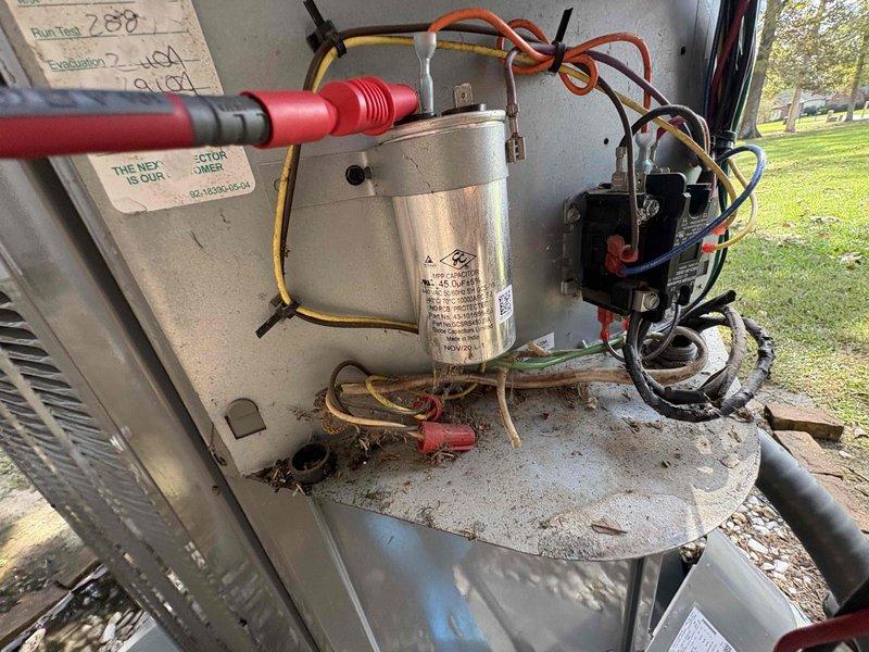 Completed comprehensive AC tune-up on single-system residential unit, including inspection of outdoor condenser components where capacitor, contactor, and electrical connections were tested and verified operational. Inspected attic air handler and ductwork, noting moisture accumulation on metallic plenum surface which was documented for monitoring. All system components functioning within normal parameters following standard maintenance protocol.