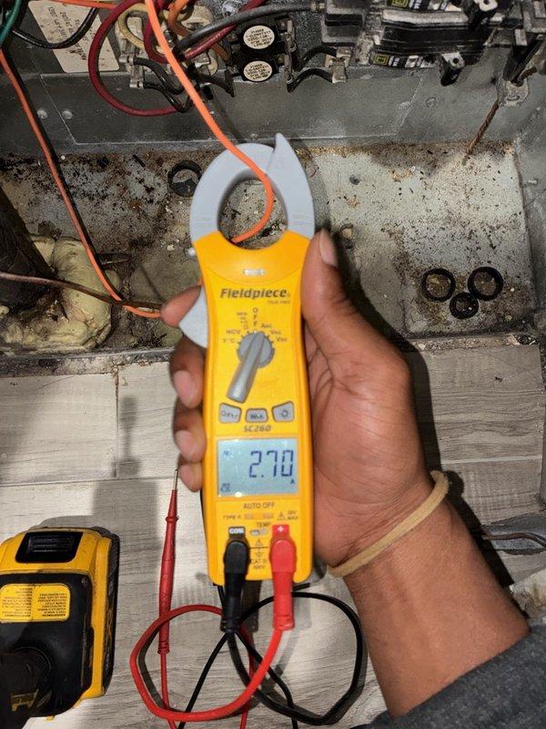 # VIJ - Heater Tune-Up

Performed comprehensive heater tune-up including complete system cleaning and detailed inspection of all components. Utilized clamp meter to verify electrical draw at 27.8 amps, confirming proper amperage within manufacturer specifications. During inspection, discovered significant frost accumulation on evaporator coils indicating potential airflow restriction or refrigerant charge issues. Documented dark discoloration and mold growth in upper unit cavity requiring attention. Observed aging copper refrigerant lines with oxidation and weathering consistent with system age. Noted dirty conditions throughout unit cabinet with visible grime and deterioration on interior surfaces. Cleaned accessible components and documented system conditions with diagnostic photos for service records. System operational at time of departure with recommendations for follow-up service to address coil icing and airflow concerns.