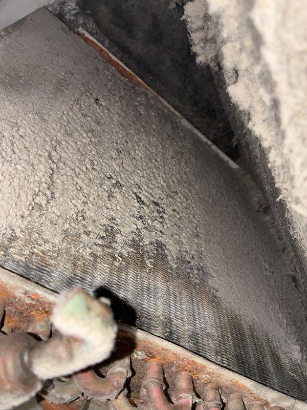 # VIJ - Heater Tune-Up

Performed comprehensive heater tune-up including complete system cleaning and detailed inspection of all components. Utilized clamp meter to verify electrical draw at 27.8 amps, confirming proper amperage within manufacturer specifications. During inspection, discovered significant frost accumulation on evaporator coils indicating potential airflow restriction or refrigerant charge issues. Documented dark discoloration and mold growth in upper unit cavity requiring attention. Observed aging copper refrigerant lines with oxidation and weathering consistent with system age. Noted dirty conditions throughout unit cabinet with visible grime and deterioration on interior surfaces. Cleaned accessible components and documented system conditions with diagnostic photos for service records. System operational at time of departure with recommendations for follow-up service to address coil icing and airflow concerns.
