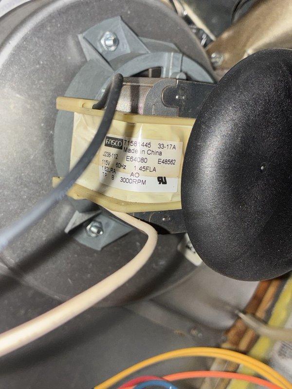Completed comprehensive heater tune-up and inspection on single-system HVAC unit. Performed thorough cleaning of blower motor assembly, verified 1/6 HP Fasco motor operating within specifications at 208-230V, 3000 RPM. Inspected condensate drain pan and documented significant rust staining and sediment accumulation indicating prolonged water exposure and oxidation. Checked all electrical connections, PVC drainage lines, and verified proper airflow through blower housing. System operational upon completion of service.