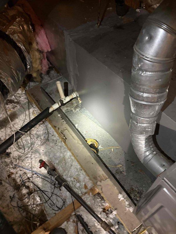 Installed pan safety switch at indoor air handler unit to provide secondary drain line protection and prevent water damage from potential condensate overflow. Sealed return air ductwork connections to eliminate air leakage and improve system efficiency. Replaced failed 45 MFD dual run capacitor at outdoor condensing unit to restore proper compressor and condenser fan motor operation. Verified all electrical connections secure, tested system operation through complete cooling cycle, and confirmed proper airflow and temperature differential across evaporator coil.