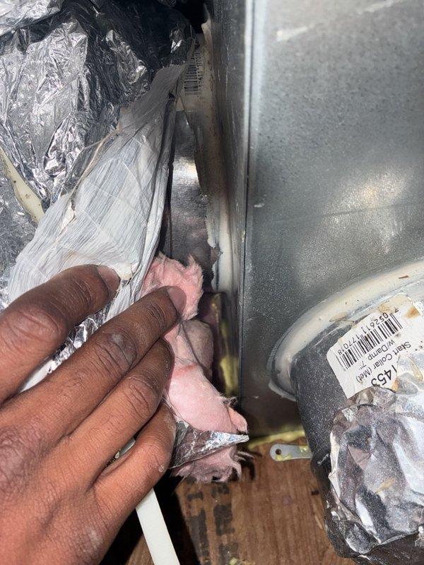 Performed a routine AC tune-up, including electrical testing of the air handler with a clamp meter and inspection of the accessible ductwork and plenum connections. The inspection revealed a torn flexible duct wrap near the plenum take-off, with exposed fiberglass insulation, which should be repaired to prevent air leakage and condensation. The system was operating normally at completion.