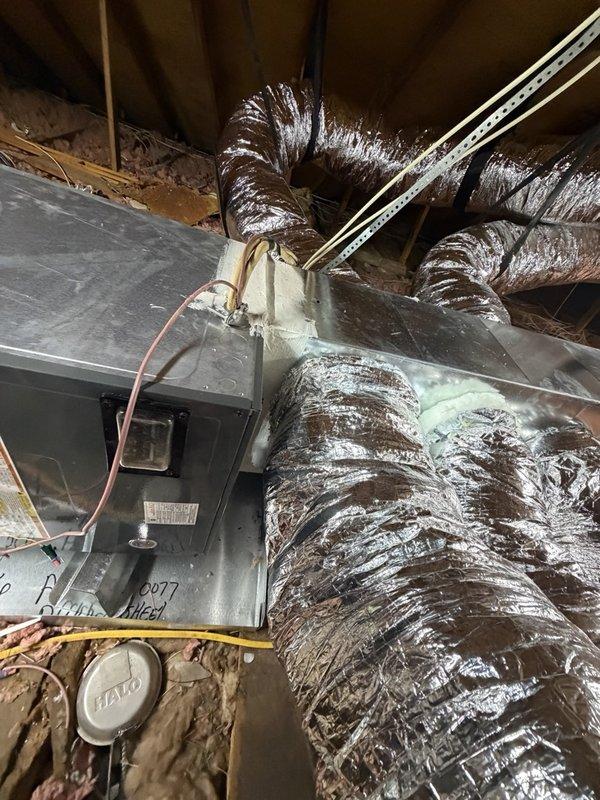 Installed a new 4-ton air handler in the attic and completed associated ductwork, including connecting insulated flexible ducts to the supply plenum with properly supported strapping. Sealed duct-to-plenum and air handler joints with mastic to ensure airtight connections, and labeled the unit for service reference. Work area was left clean, with attic insulation and the recessed lighting in the conditioned space undisturbed.