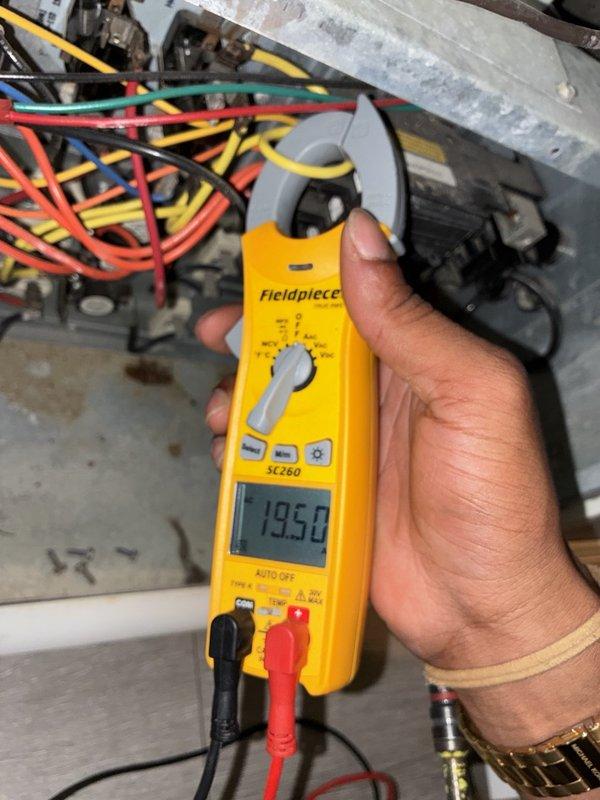 Performed a seasonal fall tune-up on one heating system, including inspection of the electrical compartment and verification of component operation. Measured amperage draw on the system's control wiring with a clamp meter (19.5 A reading) to confirm the electrical load was within normal operating parameters.