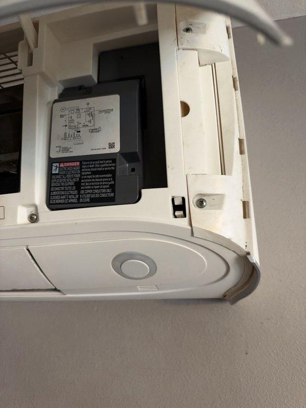 Responded to a call for a ductless mini split system intermittently shutting down and cycling off. Inspected the indoor unit and opened the front panel to examine the control box and internal components, finding no frost, ice, or corrosion. Referenced the manufacturer's service manual diagnostic procedure for the RXB24AXVJU, reviewing the four-way valve abnormality troubleshooting flowchart (coil connection, harness continuity, resistance, thermistor connection, refrigerant line) to guide further diagnosis of the intermittent shutdown.