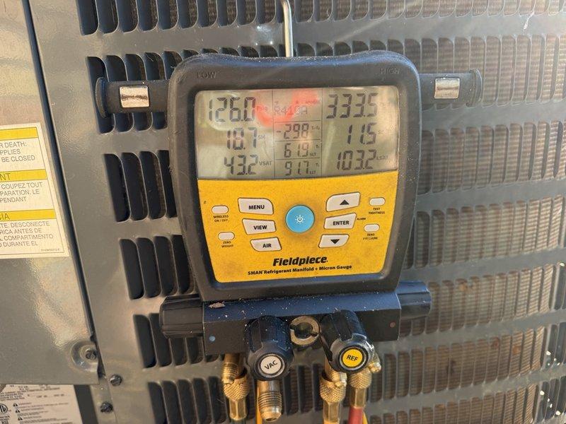 Completed furnace and evaporator coil replacement, including connection to the existing R-410A condenser and line set. Following installation, connected a digital manifold and micron gauge to verify system operation, with refrigerant pressures and superheat readings confirmed within normal range. Refrigerant line set insulation and outdoor unit connections were inspected and found to be in good condition with no signs of damage.