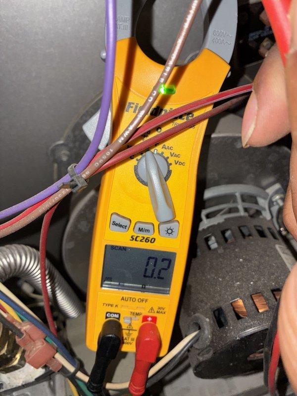 Performed a fall tune-up on the furnace, including inspection of the gas valve assembly, flex gas line connections, and control wiring terminals. Measured blower motor amperage with a clamp meter to verify proper electrical operation, and checked wiring and crimp connections for security. Cleaned the dusty cabinet interior as needed, with no visible damage, rust, or cracking noted.