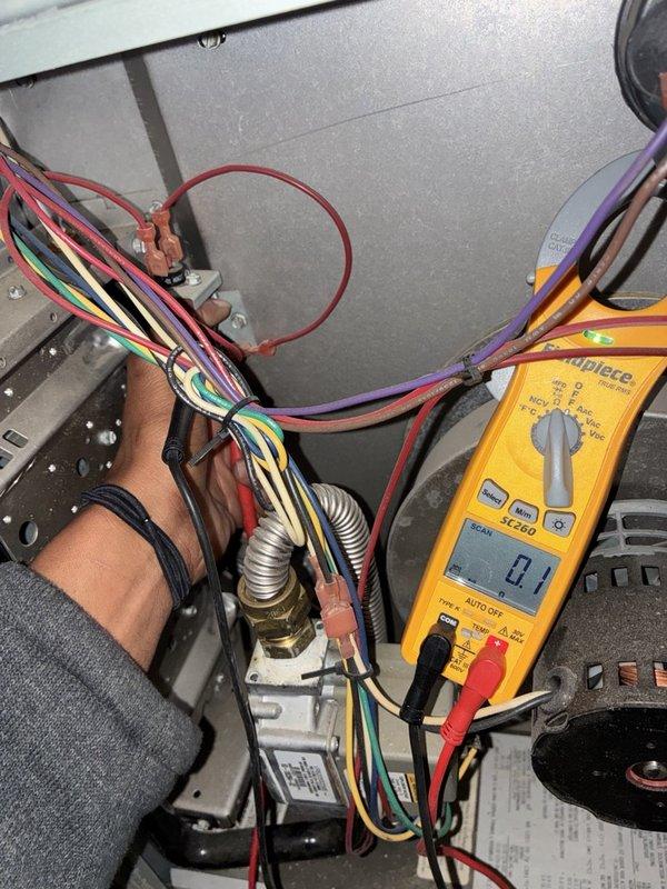 Performed a fall tune-up on the furnace, including inspection of the gas valve assembly, flex gas line connections, and control wiring terminals. Measured blower motor amperage with a clamp meter to verify proper electrical operation, and checked wiring and crimp connections for security. Cleaned the dusty cabinet interior as needed, with no visible damage, rust, or cracking noted.