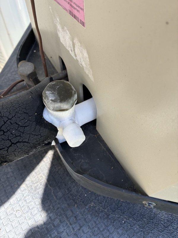 Responded to a no-cool complaint (warm air from supply) and performed a visual inspection of the outdoor condenser unit. Observed corrosion on the condenser fan motor hub and housing fasteners, debris accumulation within the cabinet, and severely deteriorated, cracked suction line insulation at the condensate/service fitting. Advised the customer to shut the system off at the thermostat and run the indoor blower only (fan-only mode) pending further diagnosis and repair.