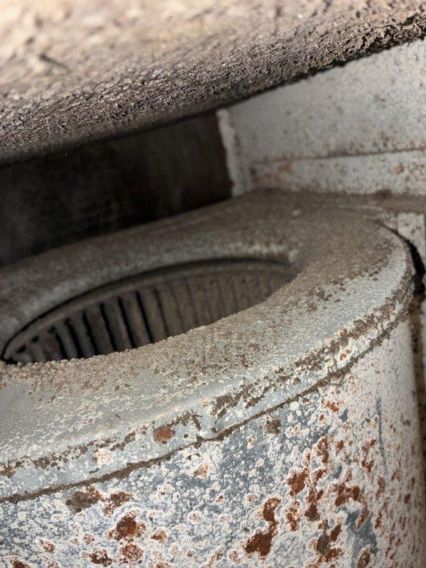 Performed a pre-sale HVAC inspection on the AC and heating system, evaluating heater operation based on the reported heating issue. Inspection of the air handler revealed a blower wheel heavily caked with dust and debris, a corroded shaft collar and set screw, and rust and heavy buildup throughout the blower housing, all of which restrict airflow and can contribute to heating performance problems. Recommend cleaning or replacing the blower assembly and addressing the corroded components.
