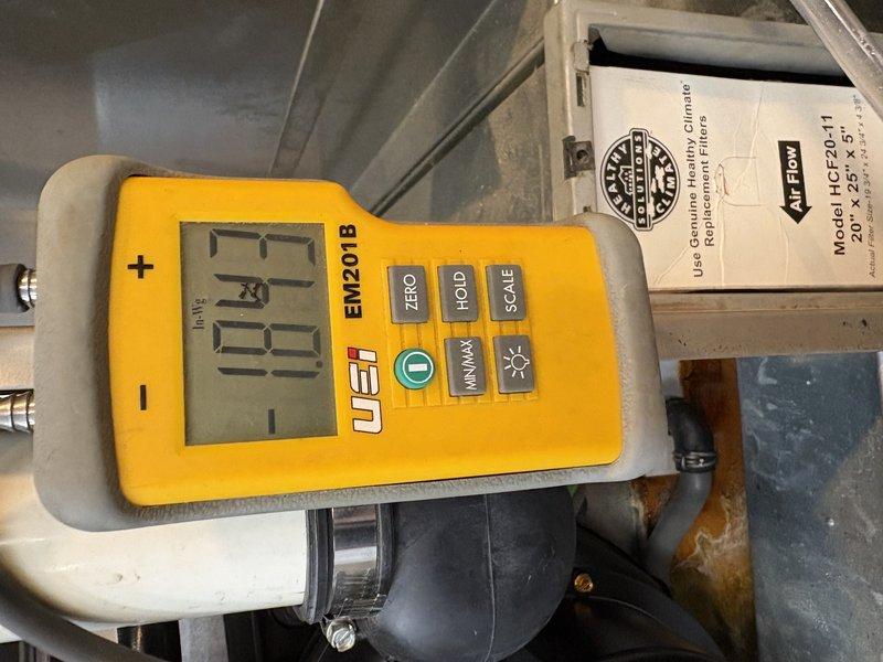 Responded to no heat complaint on 10+ year old system. Performed gas pressure testing with UEi EM201B manometer, measuring inlet pressure at 1.7" WC and outlet pressure at 20.5" WC. Confirmed system is now functioning properly after adjusting gas pressure to manufacturer specifications.