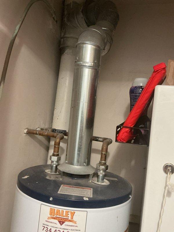 Responded to service call for Whirlpool tanked water heater not producing hot water. Diagnosed faulty thermostatic control component and replaced defective parts. System now functioning properly with restored hot water output; verified proper venting and connection integrity of copper supply lines.