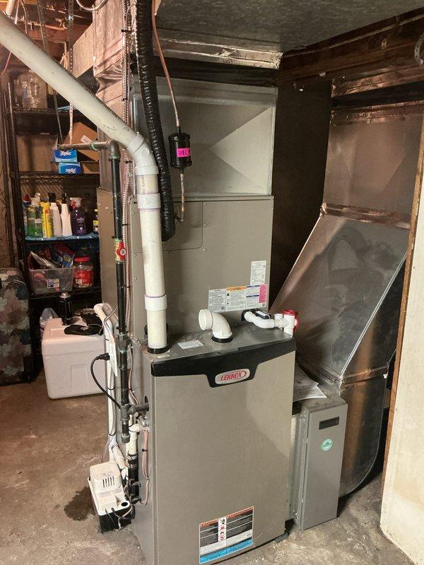 Successfully installed new Bryant air conditioning unit on exterior concrete pad with appropriate electrical connections and refrigerant lines. Completed installation of compatible indoor coil with Lennox furnace in basement utility area, ensuring proper ductwork connections and drainage. Electrical work scheduled for completion at later date by separate technician.