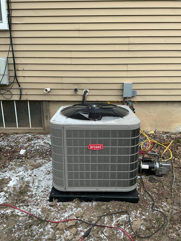 Successfully installed new Bryant air conditioning unit on exterior concrete pad with appropriate electrical connections and refrigerant lines. Completed installation of compatible indoor coil with Lennox furnace in basement utility area, ensuring proper ductwork connections and drainage. Electrical work scheduled for completion at later date by separate technician.