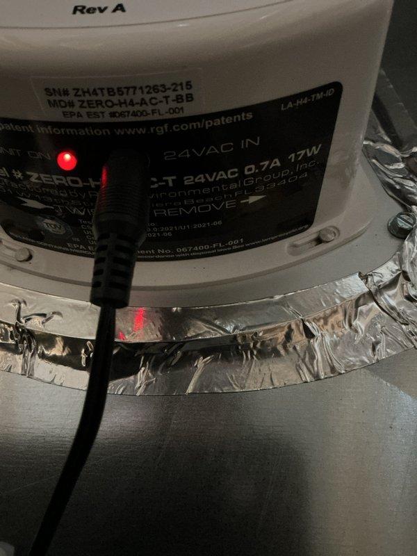 Completed installation of a complete Bryant HVAC system, including furnace unit with associated ductwork and PVC ventilation piping. System was properly mounted, connected to power with successful startup verification as indicated by illuminated LED indicator, and all connections were sealed with metallic foil tape where appropriate.