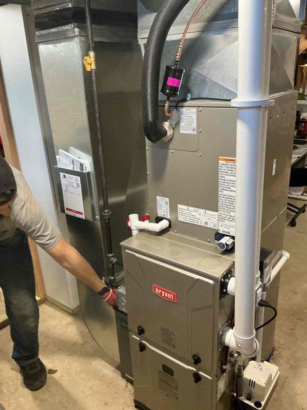 Successfully installed a complete HVAC system package including a new Bryant furnace, air conditioner, humidifier, and water heater in the customer's residence. Connected all necessary ductwork, PVC ventilation pipes, and refrigerant lines according to manufacturer specifications, and verified proper system operation before completion.