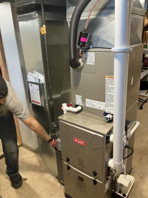 Successfully installed a complete HVAC system package including a new Bryant furnace, air conditioner, humidifier, and water heater in the customer's residence. Connected all necessary ductwork, PVC ventilation pipes, and refrigerant lines according to manufacturer specifications, and verified proper system operation before completion.