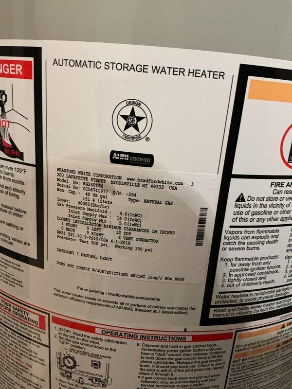 # Service Summary

Completed installation of a 40-gallon Bradford White natural gas automatic storage water heater with 40,000 BTU/hr input rating and 150 psi working pressure. Connected copper supply lines with brass fittings to the unit, installed thermal expansion tank, and integrated system with existing plumbing infrastructure. All safety labels, manufacturer specifications, and operational instructions are clearly visible on the unit, and installation meets code requirements for proper venting and clearances.