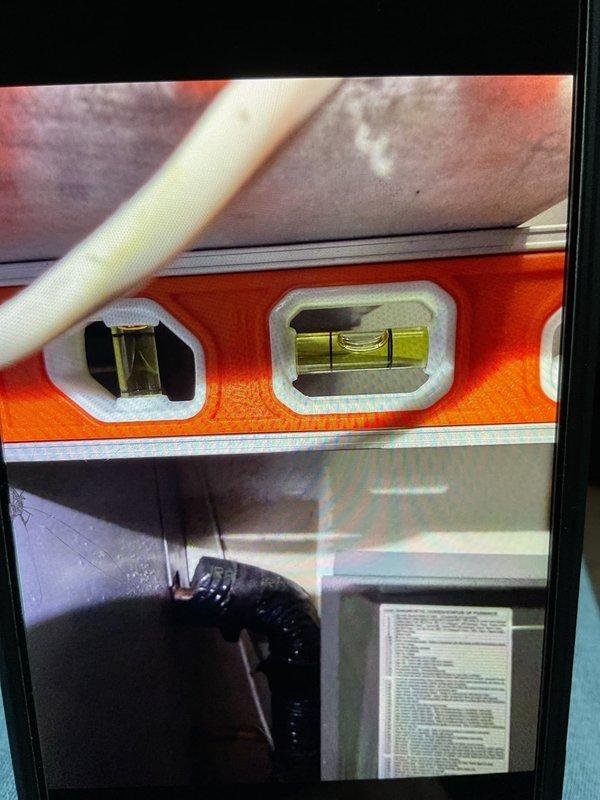 Responded to service call for 2-year-old Lennox high-efficiency gas furnace with mini-split system experiencing high pressure switch malfunction. Previous contractor had identified insect intrusion into burner assembly. Performed diagnostic evaluation, verified equipment levelness, and assessed condensation issues affecting system operation.