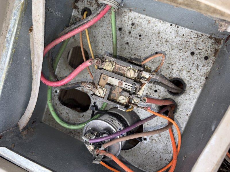 Completed scheduled cooling system tune-up and maintenance on residential AC unit. Upon inspection, discovered heavily corroded brass terminal block and contactor assembly showing significant rust and moisture damage, indicating prolonged exposure to the elements. Evaluated electrical connections, capacitor functionality, and overall system operation to ensure proper cooling performance for the upcoming season.