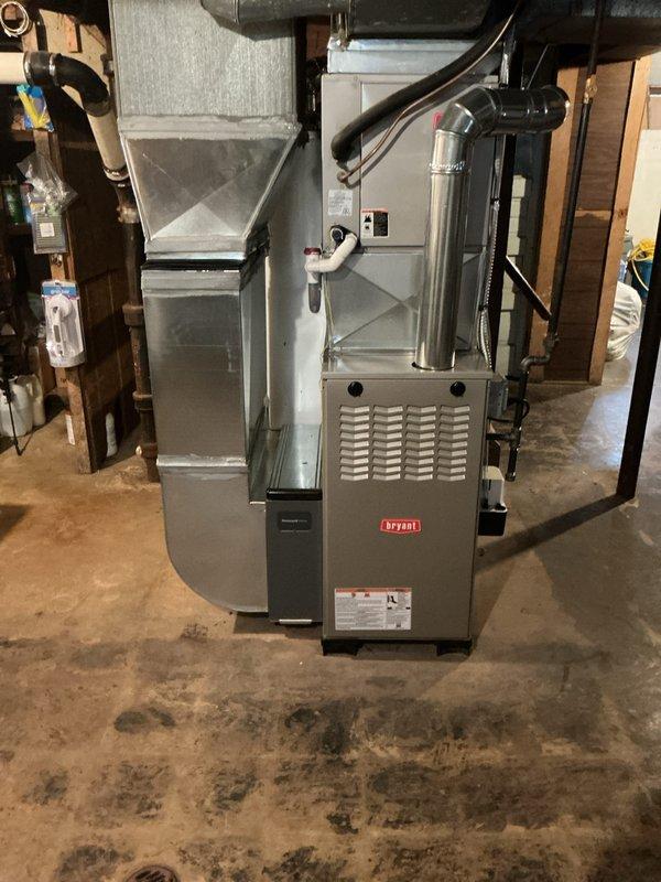 Completed installation of new Bryant gas furnace in basement utility area. Connected unit to existing ductwork system with proper plenum assembly and ventilation components, ensuring all mechanical connections, electrical conduits, and gas piping meet code requirements. System tested and verified operational.