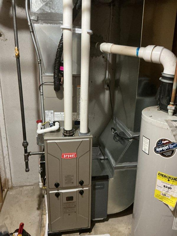 Completed full HVAC system installation in residential basement utility room, including new Bryant 96% AFUE gas furnace (Model 9DSX96G0N14A) and air conditioning system. Installed furnace with proper PVC venting configuration, connected air handler with supply and return ductwork, and integrated all electrical connections and gas lines per manufacturer specifications and local code requirements.