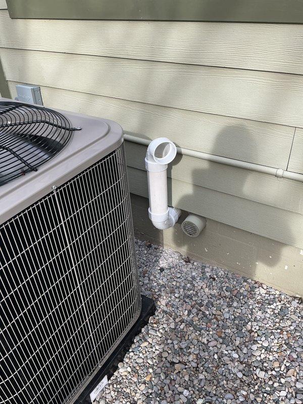 Successfully completed a full HVAC system installation including a new furnace, air conditioning unit, and whole-home humidifier. The outdoor condensing unit was professionally mounted on a gravel pad against the building exterior with proper clearances, and a PVC condensate drain line was installed and routed to ensure proper drainage. All equipment was installed to manufacturer specifications, labeled appropriately with model and manufacturing date information, and is fully operational.