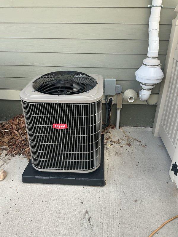 Completed full HVAC system installation including new Bryant 2-ton air conditioning condensing unit, furnace, and air purification system. Unit installed on concrete pad with proper electrical disconnect, refrigerant lines, and PVC condensate drainage system with trap configuration. Performed complete tuneup on existing hot water tank while on site to ensure optimal performance and system integration.
