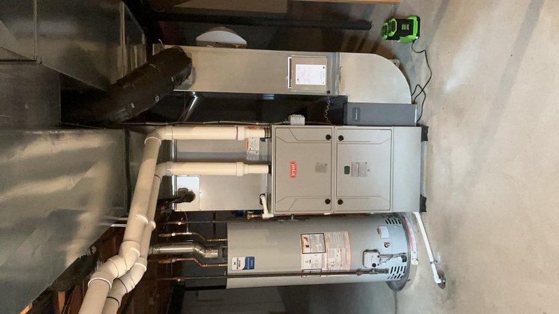 Responded to no-heat call for furnace system that was failing to fire. Diagnosed ignition failure on gas furnace unit and completed repairs under warranty coverage. Performed scheduled preventative maintenance on multi-piece HVAC system including gas furnace, air conditioning unit, and hot water tank. Addressed recurring thermostat issue previously serviced by same technician. AC maintenance rescheduled for warmer weather to allow proper system evaluation. All heating equipment restored to normal operation and tested for proper cycling.