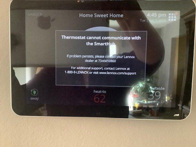 Responded to warranty call for Lennox smart thermostat displaying communication error with SmartHub. Upon arrival, confirmed thermostat was showing "cannot communicate with SmartHub" message on display. Inspected attic installation and verified all low-voltage wiring connections between thermostat and equipment. Traced communication wire through framing to locate potential connection issues. Troubleshot system communication protocol, reset thermostat and SmartHub connection, and verified proper network connectivity. System restored to full operation with thermostat successfully communicating with SmartHub and controlling HVAC equipment as designed.